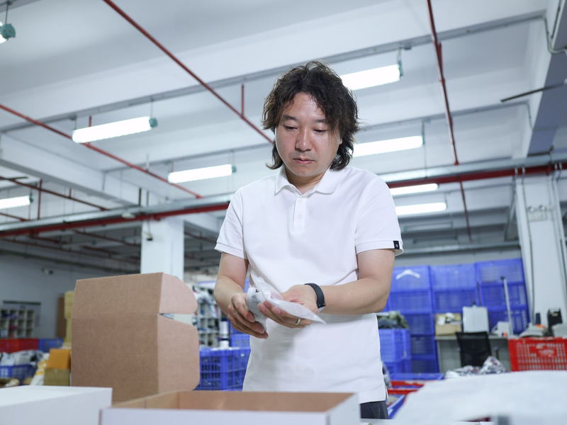 ASG packing station preparing branded ecommerce parcels