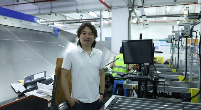 ASG warehouse running pre-scale stress test backup supplier activation and per-lane first-scan time monitoring during a TikTok Shop viral product surge