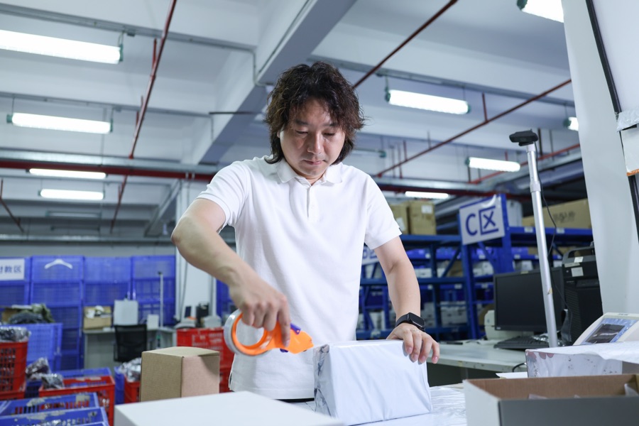 A parcel being opened at a workbench