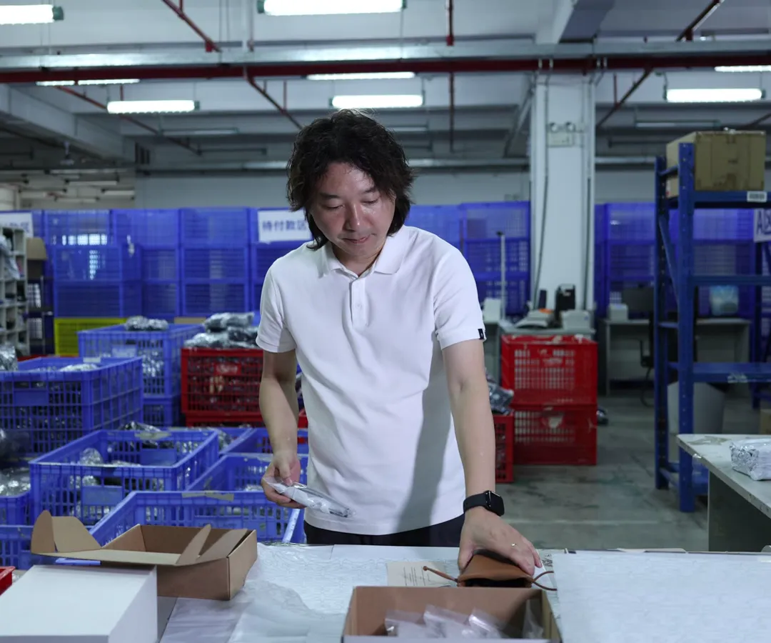 Founder Janson Wang checking orders at the ASG pack-out area