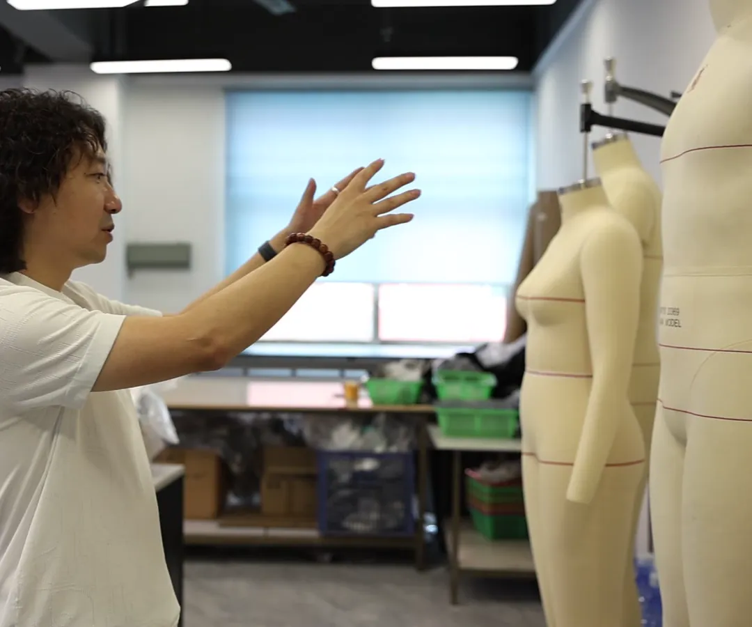 Founder Janson Wang explaining sample development in a garment factory