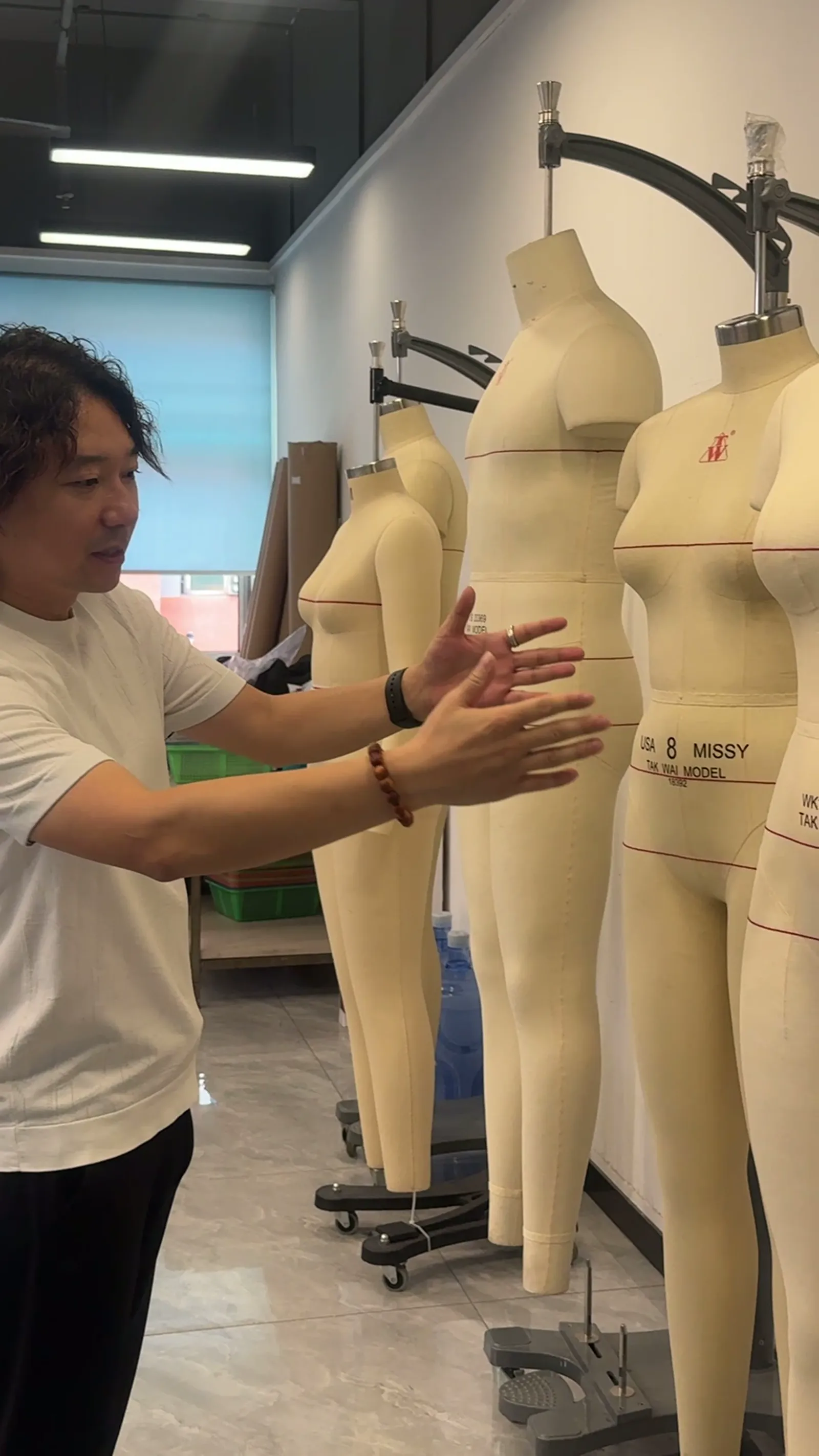 Pattern fitting on dress forms in the sample room