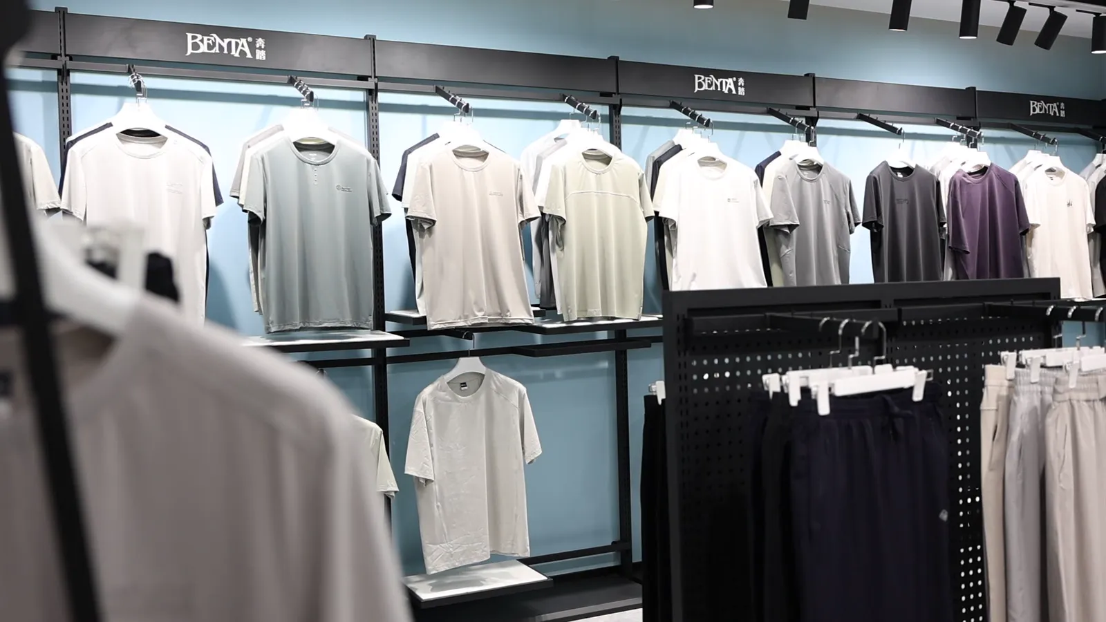 Garment sample room with approved samples on rails