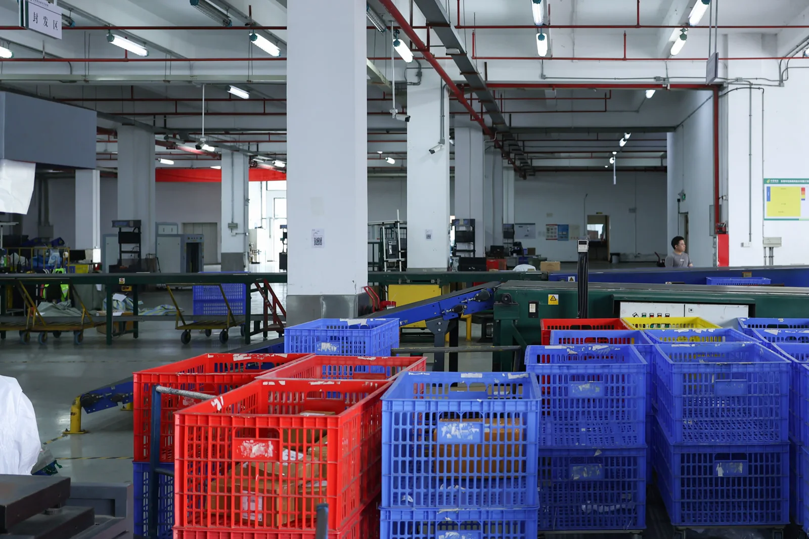 Sorting crates and conveyor line inside the ASG fulfillment warehouse