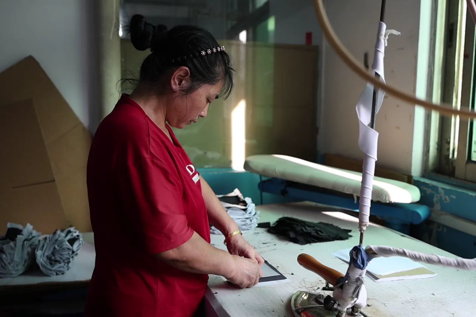 Pressing a finished garment before packing