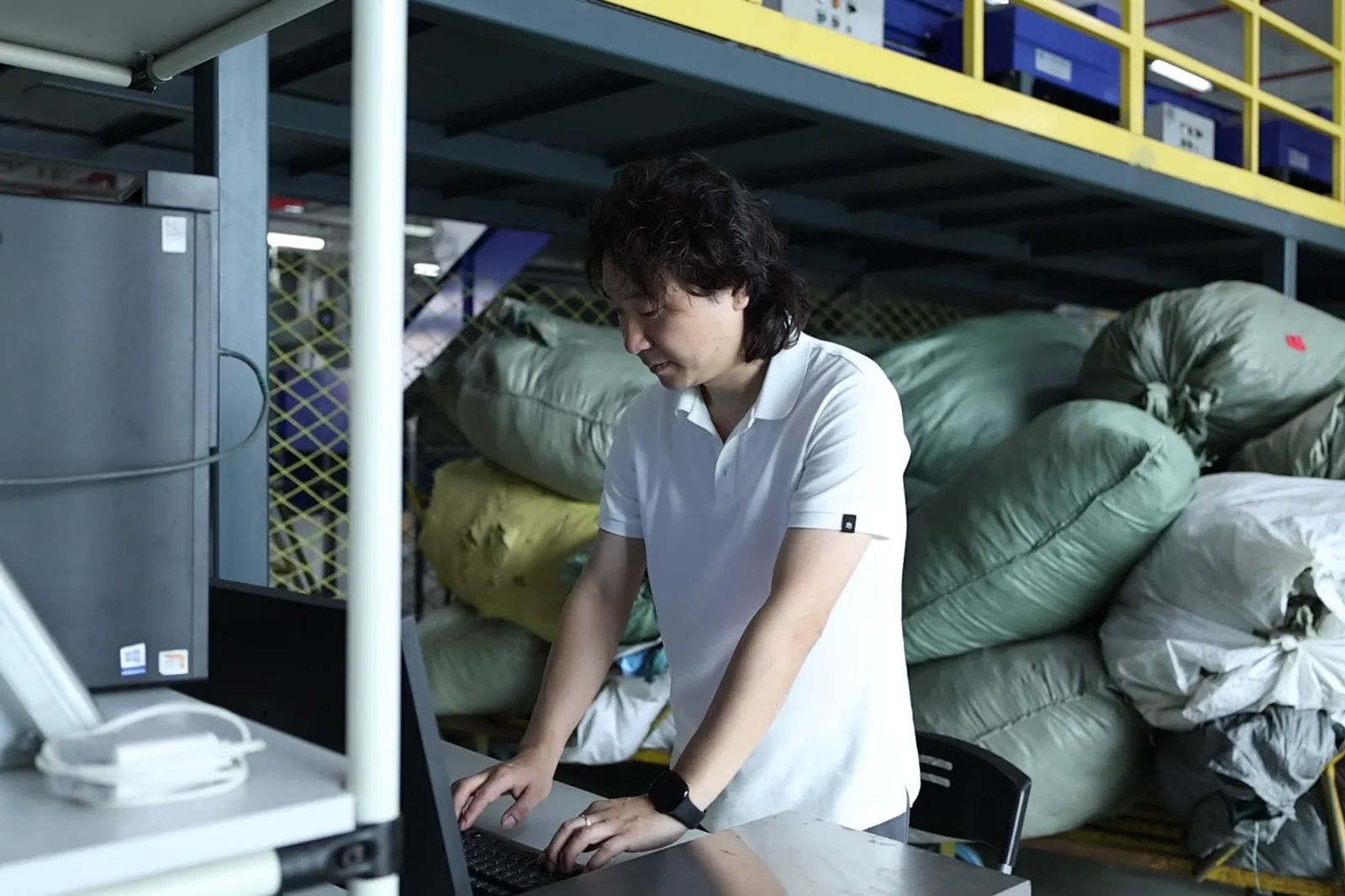 ASG team member packing an ecommerce order in a China warehouse