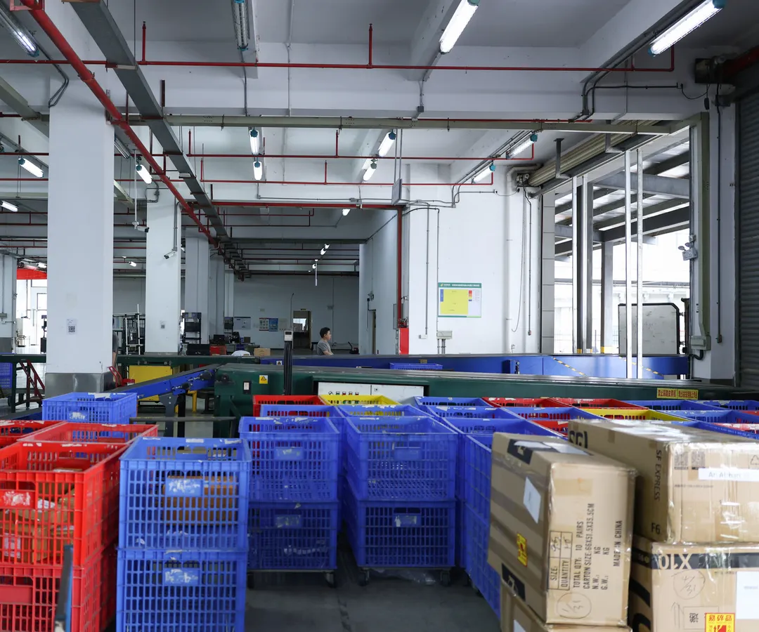 Stacked crates and totes in the ASG receiving area