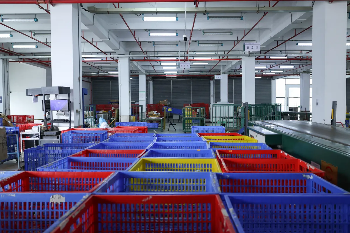 Sorted totes waiting on the warehouse floor