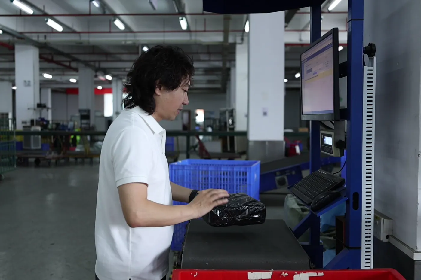 Founder Janson Wang scanning parcels at an ASG packing workstation