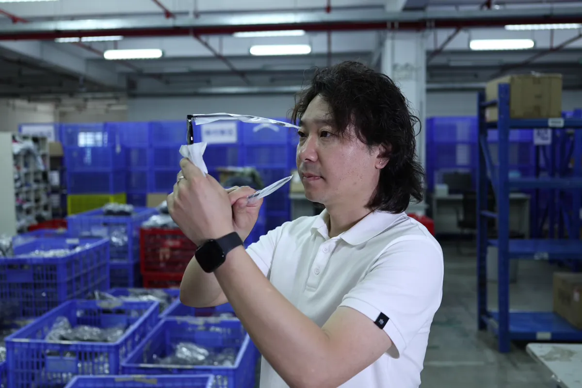 Inspecting an item by hand in the ASG warehouse