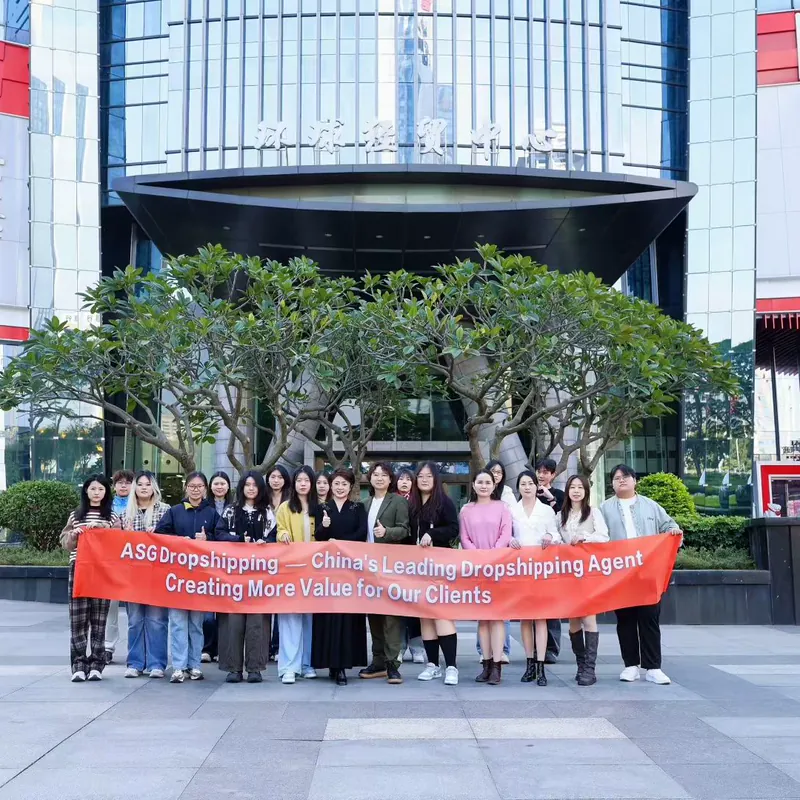ASG team holding a company banner outside an office tower