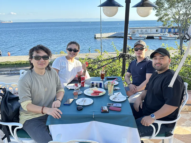ASG team meeting clients over lunch by the sea