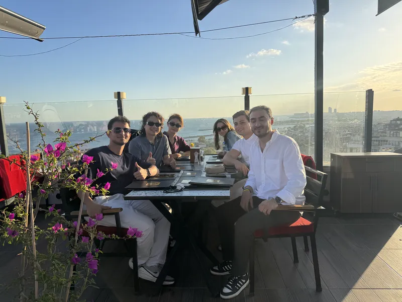 ASG team at a rooftop dinner with clients