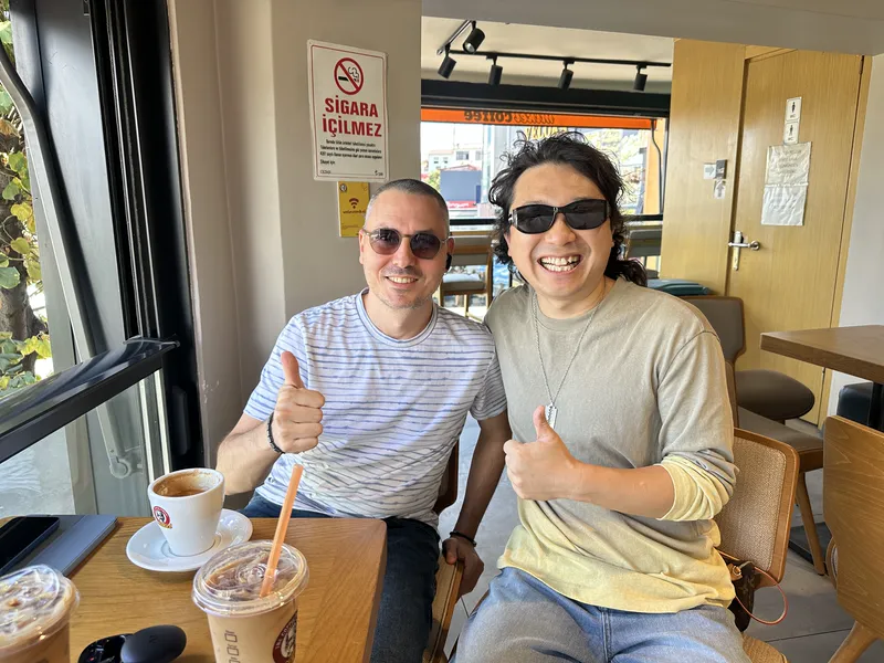 Founder Janson Wang with a client at a café