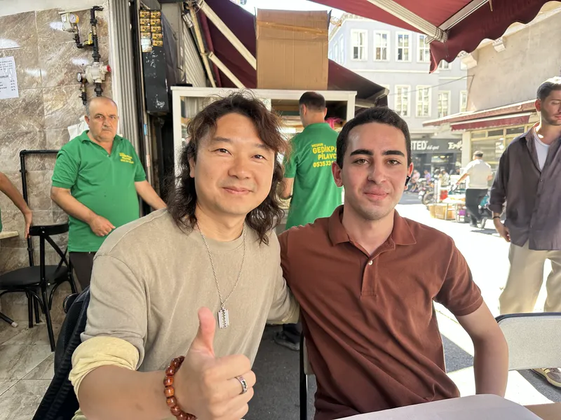 Founder Janson Wang with a client at a market visit