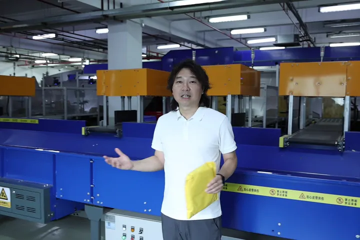 ASG team member at the automated sorting line